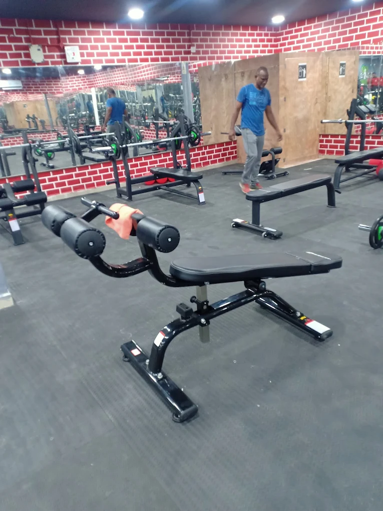 Gym floor with benches and barbells